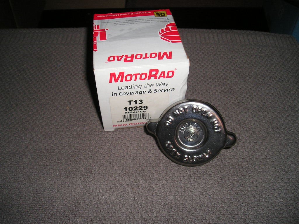 Ford65_73_Motorad_T13_Kühlerdeckel_Metall_1.JPG